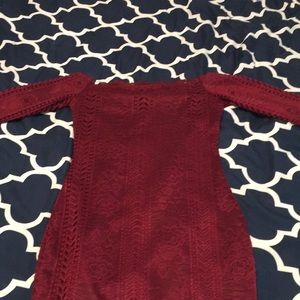 Red off the shoulder dress.